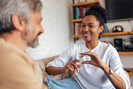 Healthcare professional engaging in a personalized intake discussion with a patient, demonstrating a patient-centered approach to care.