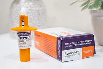Spravato (esketamine) nasal spray trainer device and packaging, representing innovative treatment options for depression.
